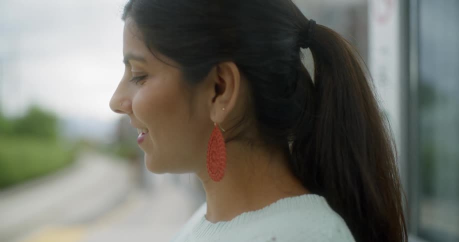 A woman looks forward and smile