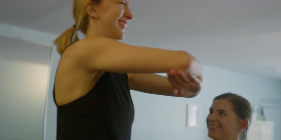 Woman Instructing Pilates Class