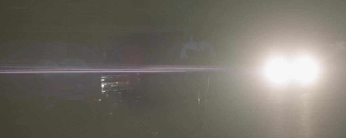 A man jogs outside at night