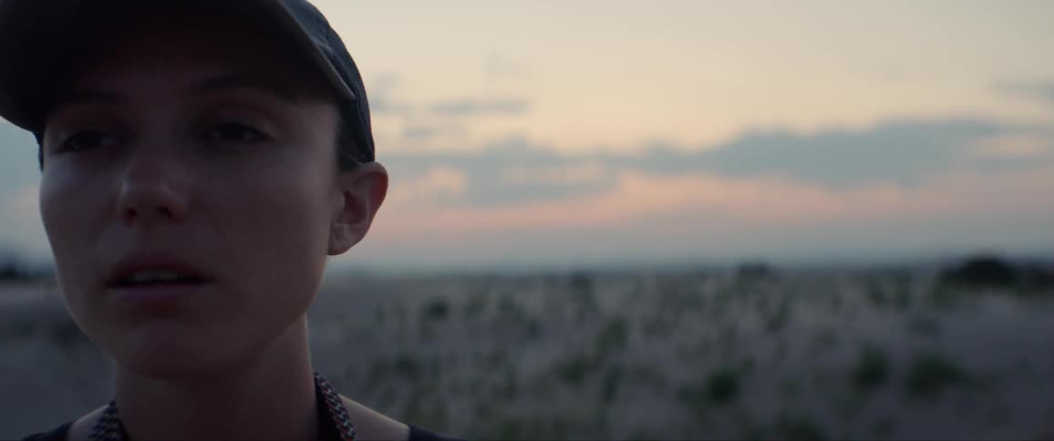 A woman staring off with a blank expression