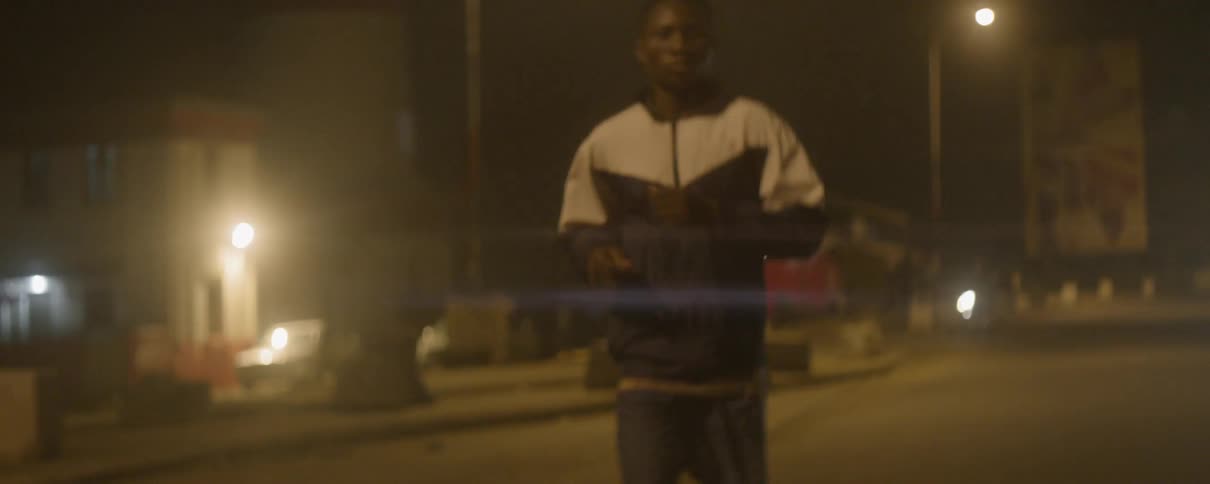 A man jogs outside at night
