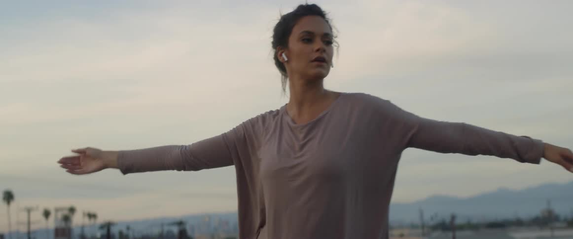 Dancers On Rooftop Overlooking City
