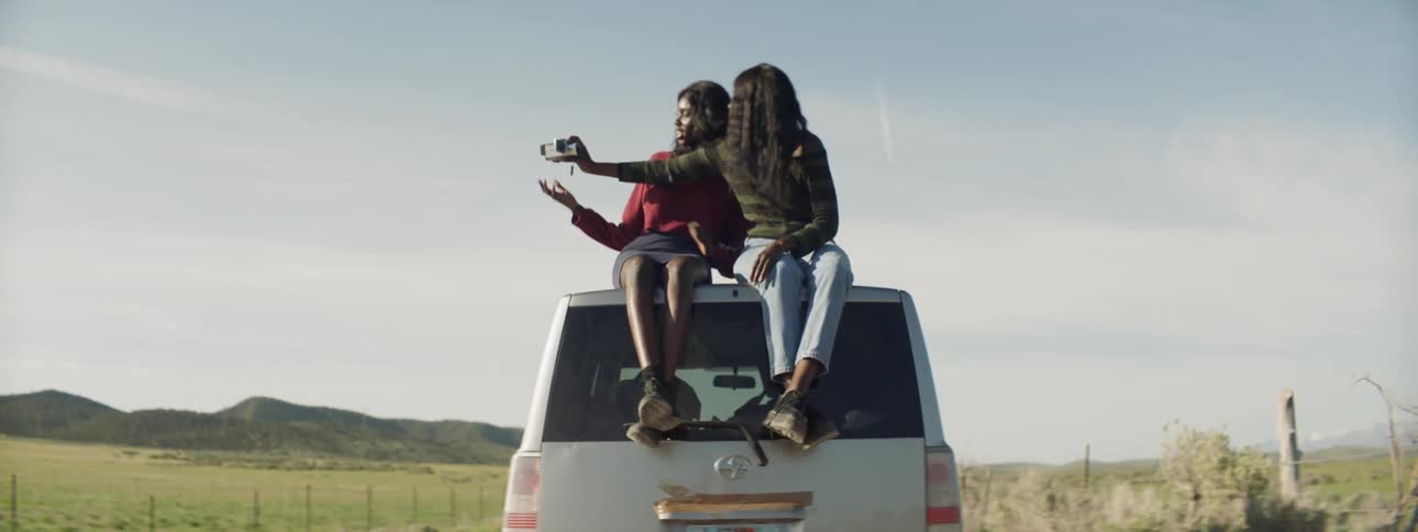 Sisters Filming Each Other With Camcorder