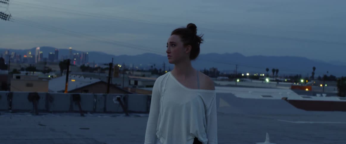 Dancers On Rooftop Overlooking City