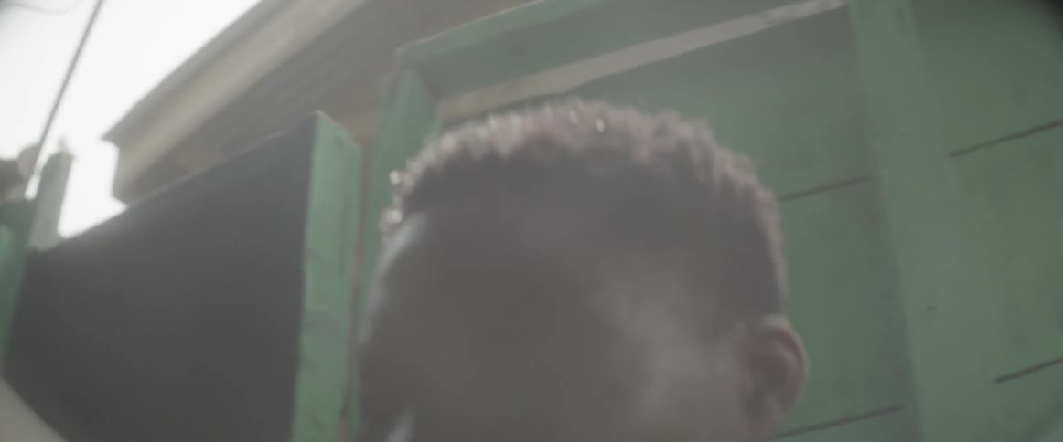 Man pouring water over his face