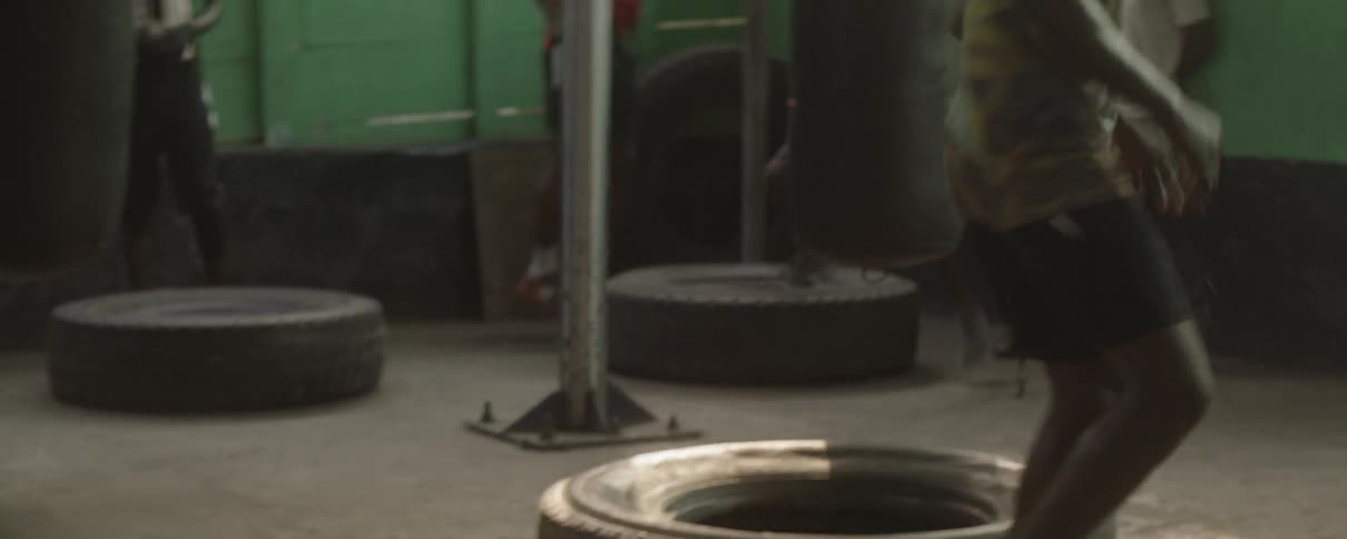 Men exercise in a gym