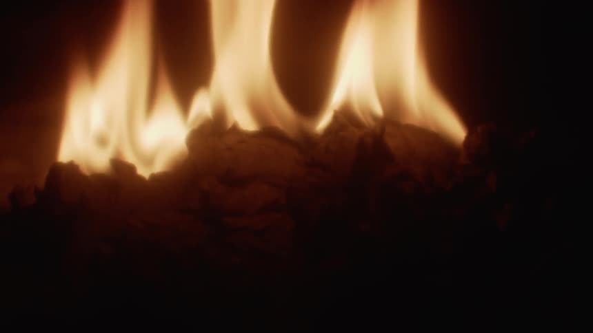 A fire burns at night
