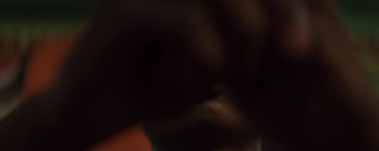 A man sits and stares in thought