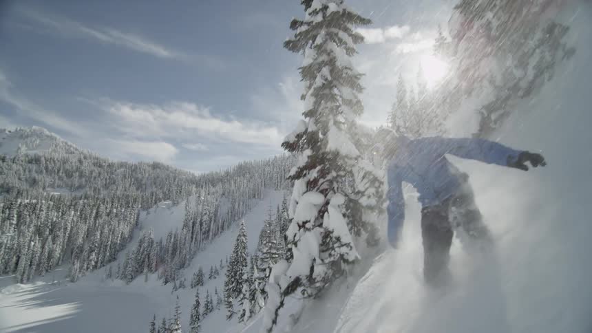 Person snowboarding down a mountain