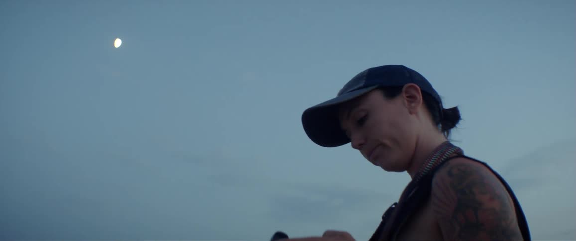Woman Exploring Sand Dunes At Dusk