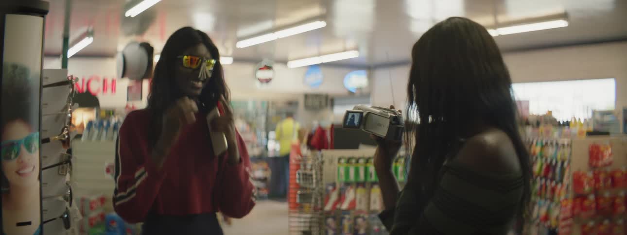 Sisters Filming Each Other With Camcorder
