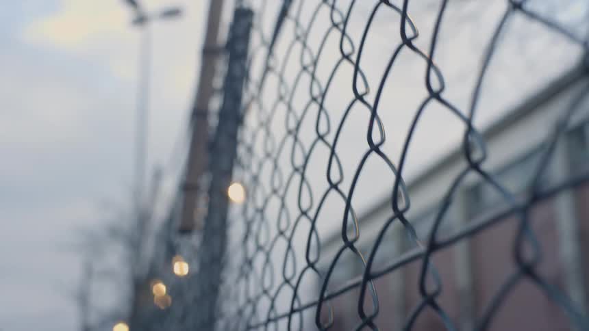 Lights strung up along a wire fence