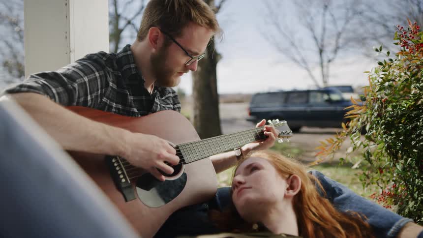Young Couple Playing Music And Exploring