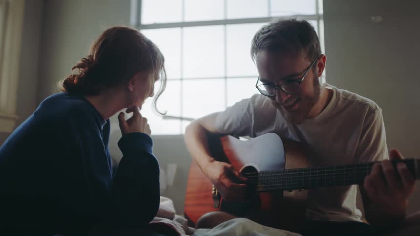 Young Couple Playing Music And Exploring