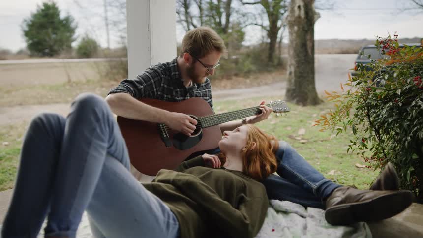 Young Couple Playing Music And Exploring