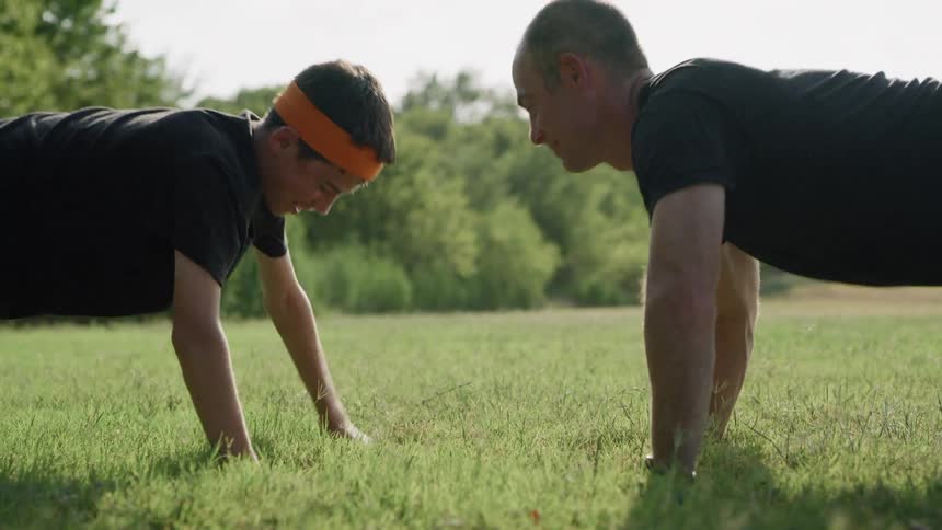 Two men do push ups