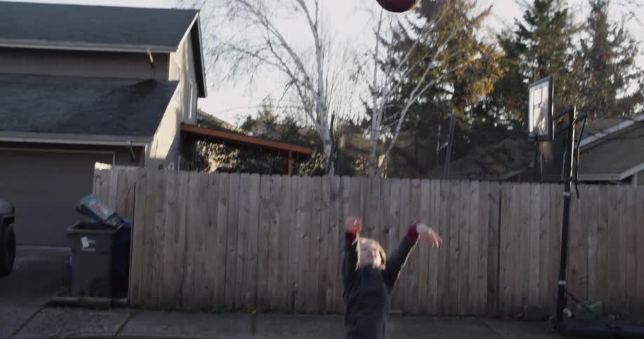 A boy playing basketball