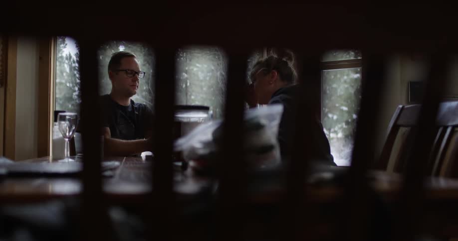 Two people sit at a restaurant table