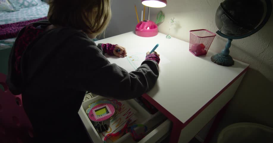 A child is sorting her drawer