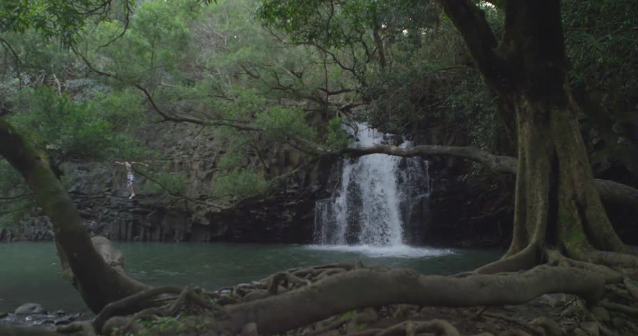 A waterfall empties into a lake
