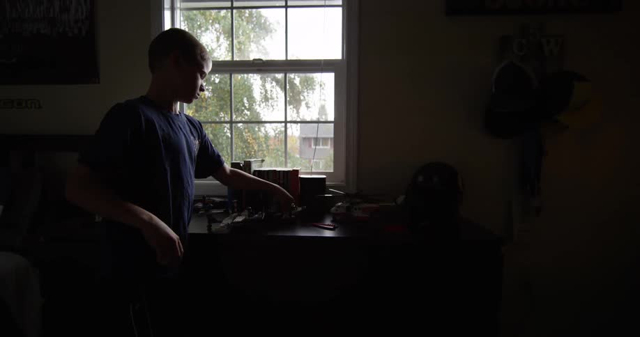 A boy plays with a plane