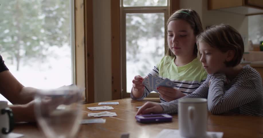 Kids are playing cards