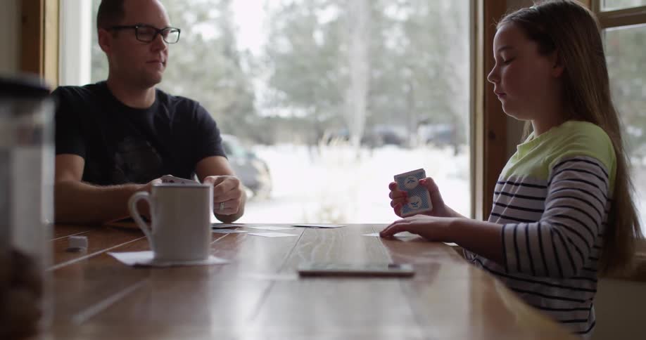 People playing cards at a table