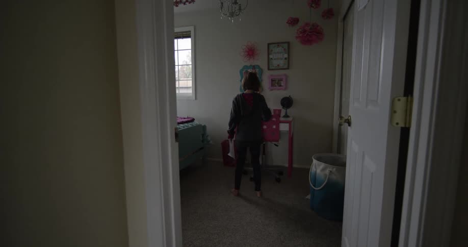 A girl leaving her bedroom desk