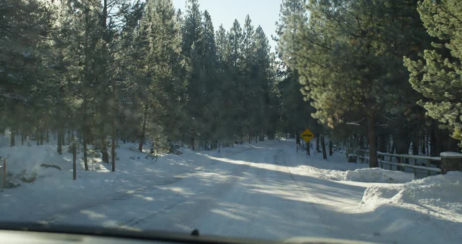 Driving down a snow covered road