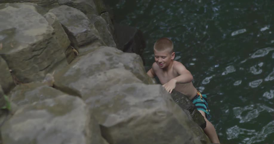A person climbing up rocks