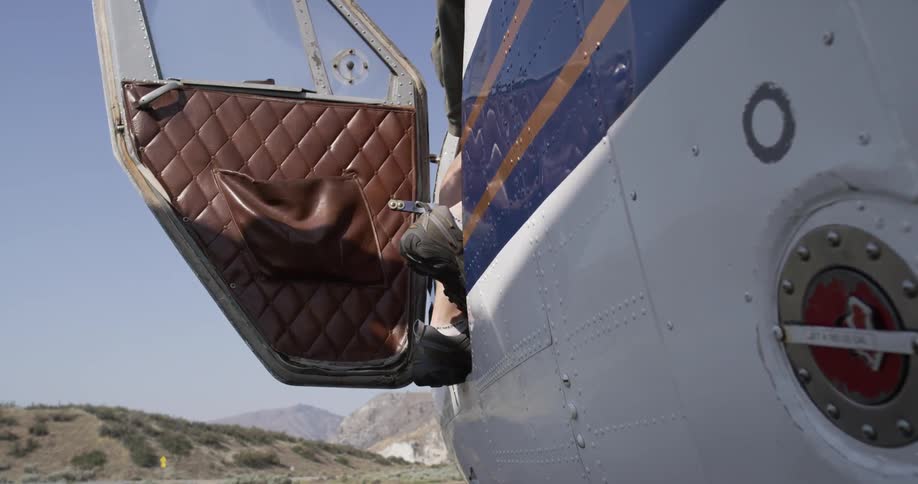 A man is entering a plane