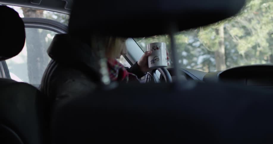 A person getting in a car