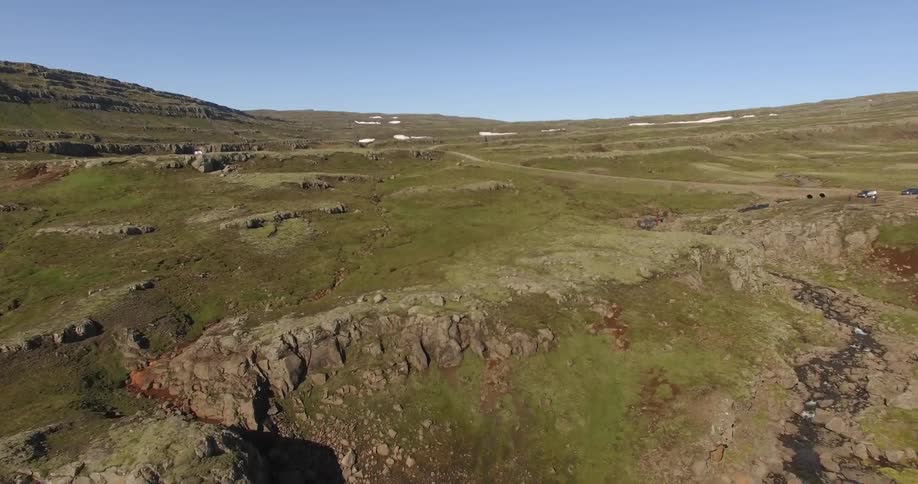 A creek doing through a mountain