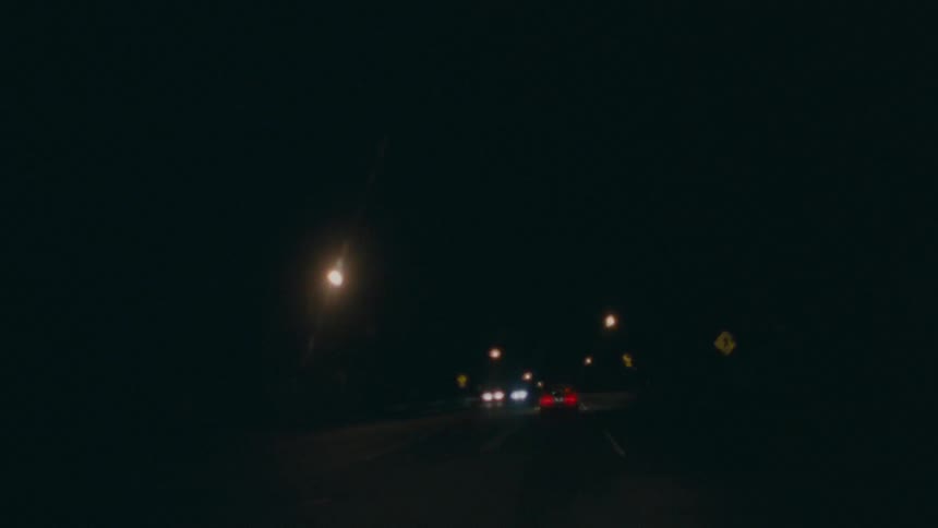 First person, time lapse view of driving down a road