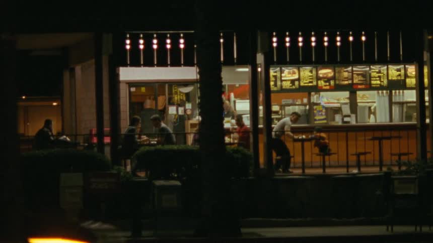 People eating in a restaurant in a city