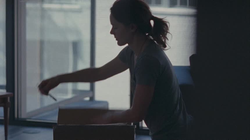 A person opening a box