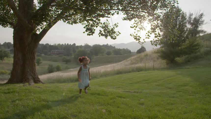 A child running in the grass