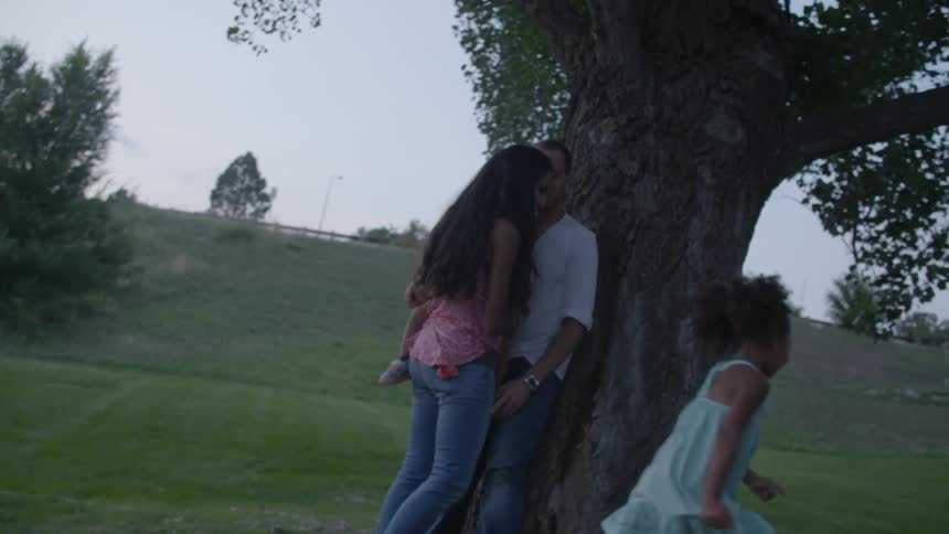 A family is under a tree