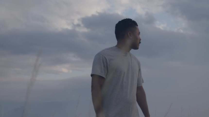 Man is standing in a field