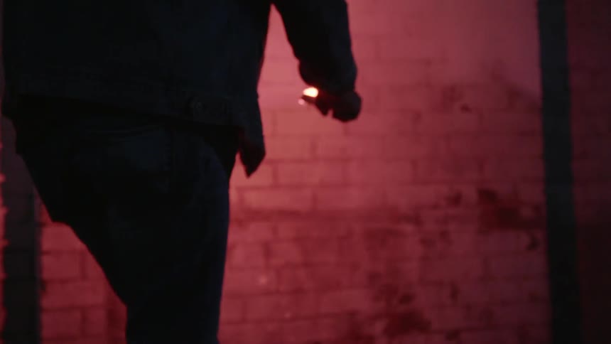 A man is holding a flare