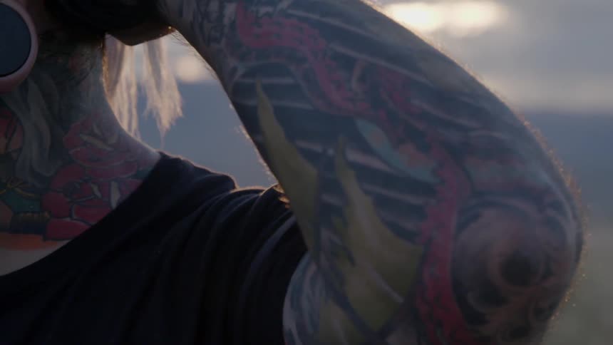 A person with an arm tattoo