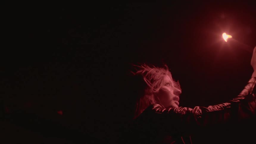 A person holding a flare