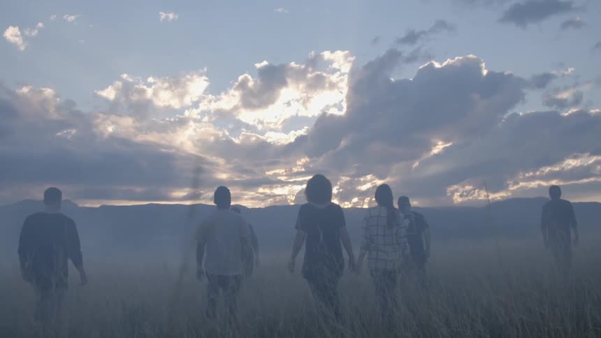 People are walking through the mist