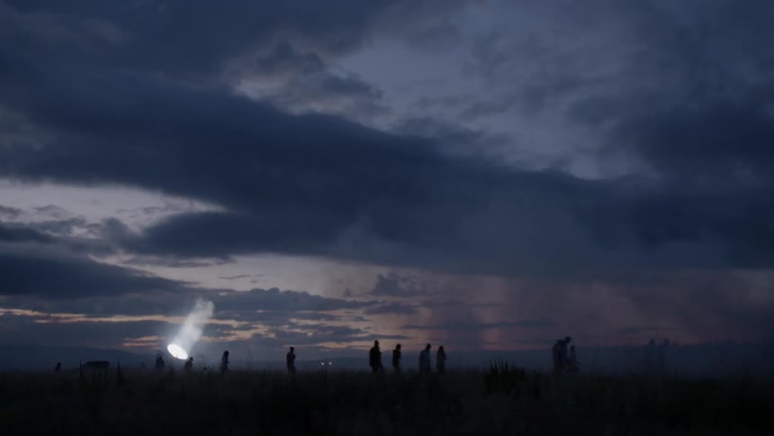 People are walking at dusk