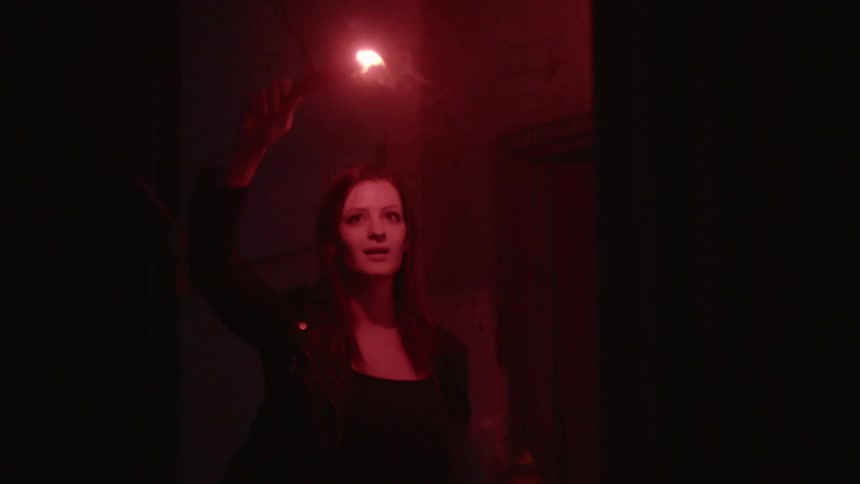 A person holding a flare