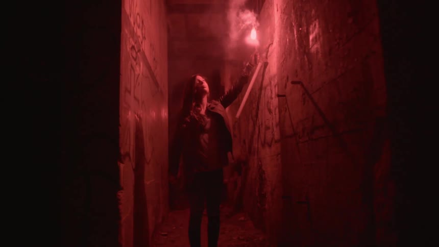 A woman is carrying a torch