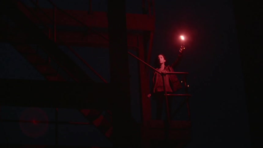 A person holding a flare