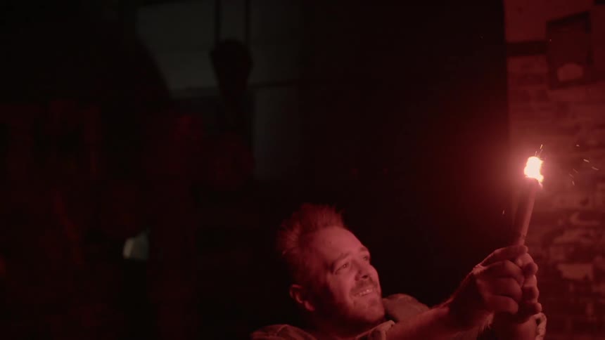 A person holding a flare