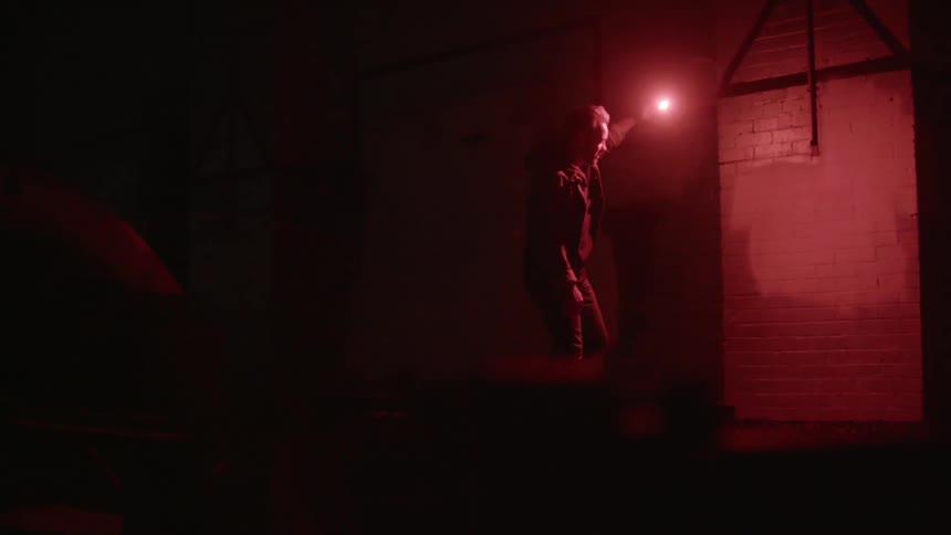 A person holding a flare