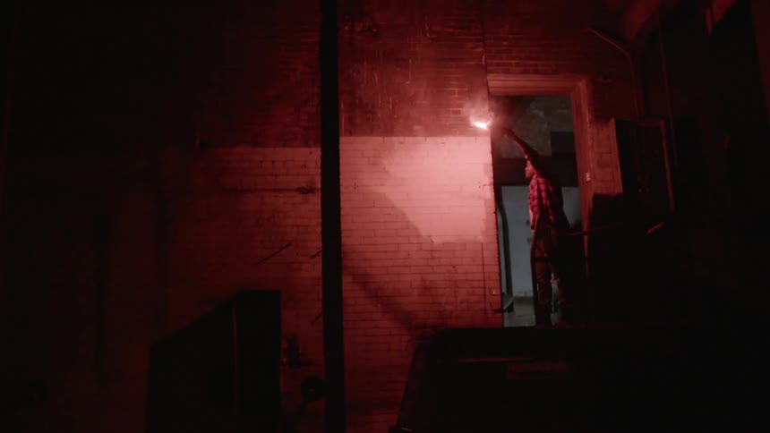 A person holding a flare